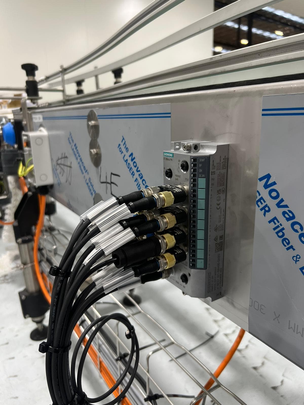 End of line conveyor system for composite packs