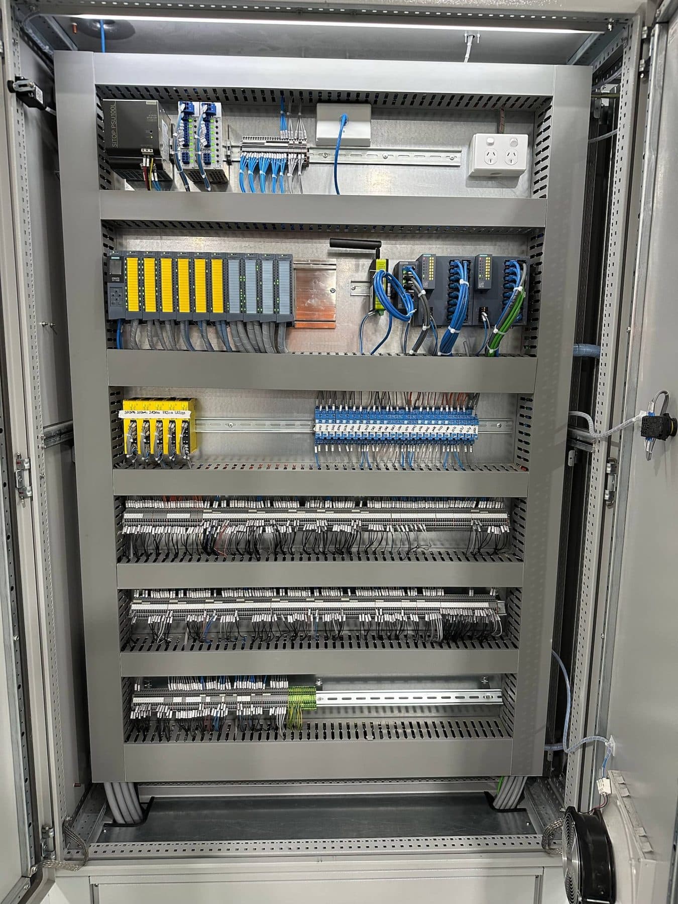 Scope electricians installing drive and sensor wiring on site